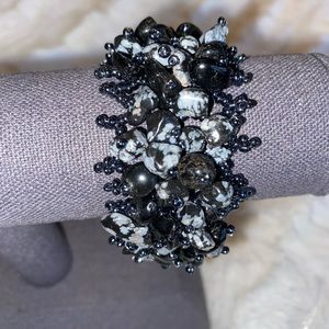 Beaded bracelet with black onyx and snowflake obsidian.